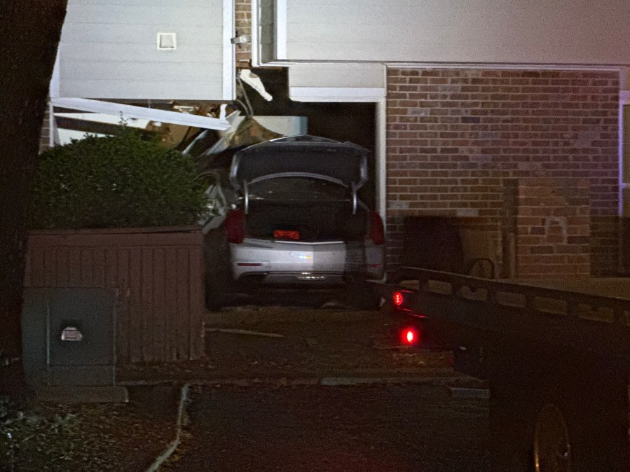 Neighbor says man crashed car into apartment with kids inside