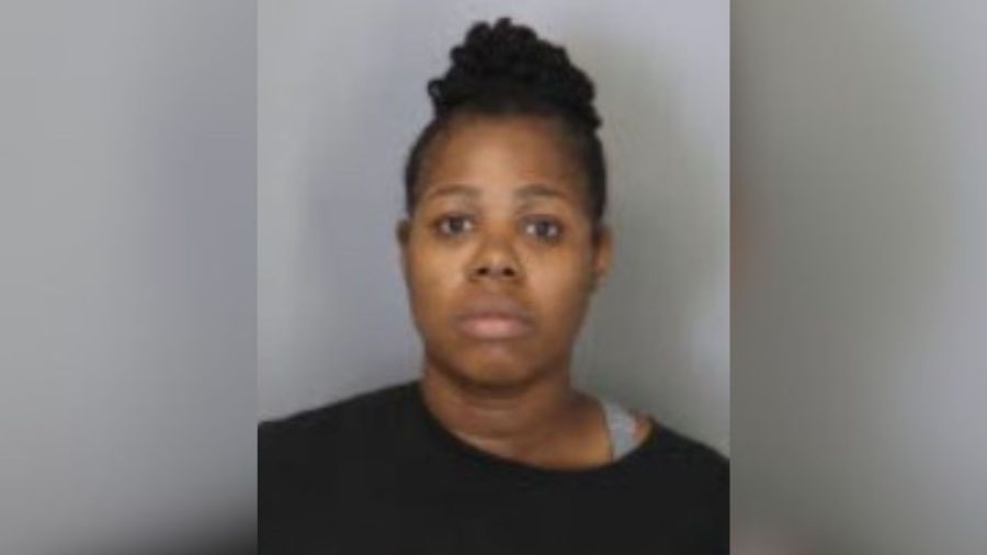 Woman charged with shooting man found under daughter's bed